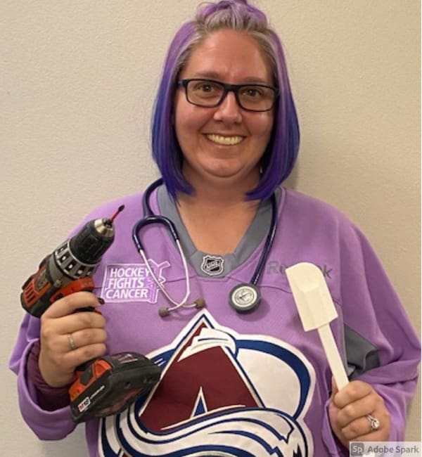 A woman holding a drill and a spoon