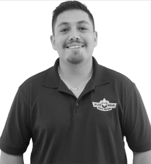 A man in black shirt smiling for the camera.