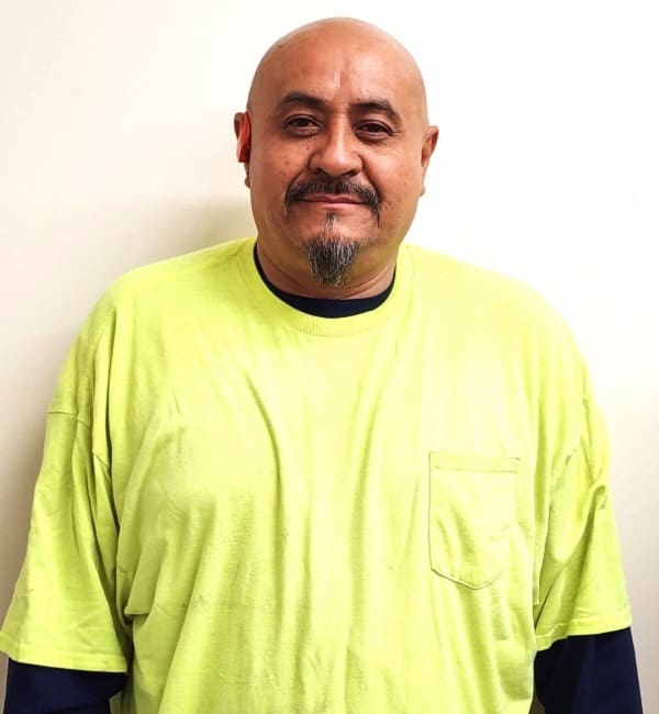 A man in an electric green shirt.